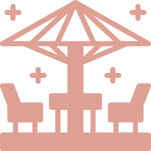 Icon of an outdoor patio set with an umbrella, two chairs, and a table in solid coral, adorned with decorative accents—perfect for illustrating cozy spaces in Retirement Homes.